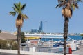 A Street Close to the Port of Barcelona with Trucks, Palm Trees and other vehicle, Spain