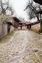 Street with cobble stones of folk museum Zheravna village in Bulgaria Royalty Free Stock Photo