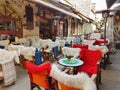 Street coffee shop tables and chairs with warm cloth in Kalari street Ioannina city