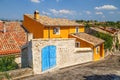 Street with colorful authentic houses in Valensole, Provence, France.