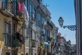 Street with colorful drying clothes in old buildings Royalty Free Stock Photo