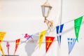 Street with colorful flags in Mykonos, Greece Royalty Free Stock Photo