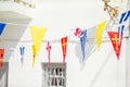 Street with colorful flags in Mykonos, Greece Royalty Free Stock Photo