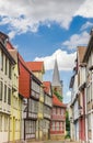 Street with colorful houses and church tower in Quedlinburg Royalty Free Stock Photo