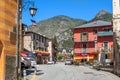 Street among colorful houses in Tende, France.