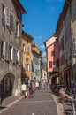 Street with colorful old buildings and pedestrians in Annecy. Royalty Free Stock Photo