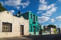 Street with colorful renovated colonial house facades in Merida, Mexico Royalty Free Stock Photo