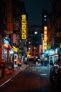A street with colorful signs at night in Chinatown, Manhattan, New York City Royalty Free Stock Photo