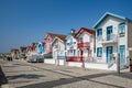 Street with colorful striped houses typical of Costa Nova, Aveiro, Portugal