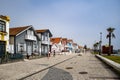 Street with colorful striped houses typical of Costa Nova, Aveiro, Portugal