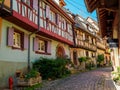Street with colorful traditional french houses in Eguisheim, France Royalty Free Stock Photo