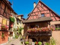 Street with colorful traditional french houses in Eguisheim, France Royalty Free Stock Photo