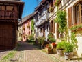 Street with colorful traditional french houses in Eguisheim, France Royalty Free Stock Photo