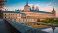 Panoramic view of the monastery and royal place El Escorial in Spain at sunset in fall Royalty Free Stock Photo
