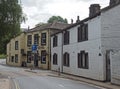 Street corner in the old village centre in mytholmroyd west yorkshire with traditional stone houses and the shoulder of mutton pub Royalty Free Stock Photo