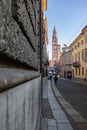 Street Corso Vittorio Emanuele II with a view in the Distance of the Torrazzo in Cremona located next to the Cathedral, Italy Royalty Free Stock Photo