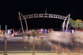 People blur at Surfers Paradise gate by night