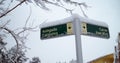 Street crossing sign Tarragona covered by snow