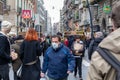 Street crowded with people with protective masks, in Naples, Italy