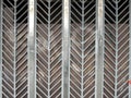 Street curly herringbone metal fence with geometric pattern Royalty Free Stock Photo