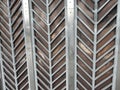 Street curly herringbone metal fence with geometric pattern Royalty Free Stock Photo