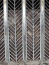 Street curly herringbone metal fence with geometric pattern Royalty Free Stock Photo