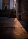 Street of CÃÂ¡ceres old town with the Church of San Francisco Javier in the background at sunset, UNESCO World Heritage City,