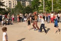 A street dancer doing a dance show in a Paris street, using children in the public Royalty Free Stock Photo