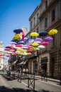 Street decorated with colored umbrellas. Arles, Provence. France