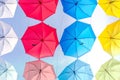 Street decorated with colorful umbrellas hanging on top side in the sky. Royalty Free Stock Photo