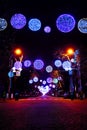 Street decorated with multicolor christmas lights