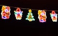 Street decorated with multicolor christmas lights