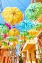 Street decorated with umbrellas of different colours