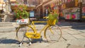 Street decoration in Tropea town, vibrant bicycle floral pot