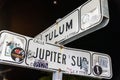 Street directional sign show the location of Tulum and Jupiter