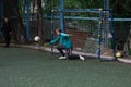 Russia, Khabarovsk - Jun 11, 2019: street domestic playing soccer. Young guys play soccer on a green grass