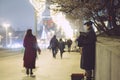 Street elderly musician on an evening street in the center of Moscow. New Year`s winter Moscow