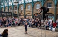 Street entertainer at Covent Garden market, London UK, entertaining the crowds during the summer holidays. Royalty Free Stock Photo