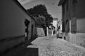 A street in a european town at midday in black and white