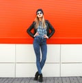 Street fashion concept - stylish hipster woman in rock