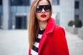 Street fashion concept. Young beautiful model in the city. Beautiful blonde woman wearing sunglasses Royalty Free Stock Photo