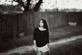 Street fashion portrait of a young dark hair girl