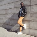 Street fashion, stylish young african man wearing a sunglasses