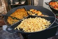 Street fast food- French fries, soared peas and fried pork pie