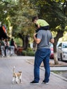 Hello, baby! Father and son play with cute street cat