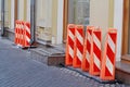 Street fences in the form of tall orange pillars of plastic Royalty Free Stock Photo