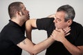 Street fighting self defense technique against holds and grabs Royalty Free Stock Photo