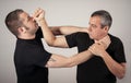 Street fighting self defense technique against holds and grabs Royalty Free Stock Photo