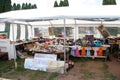 Street flea market with dishes, antiques, things for home decoration, paintings and toys