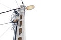 Street flood light post with   lot of wires against  white sky background. With space for text. Energy distribution concept Royalty Free Stock Photo